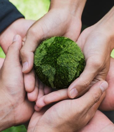 Earth Day. Hands adult Teamwork harmony Holding earth on hands. Environmental and reduce global warming help earth, top view. ecology and environment sustainable concept.